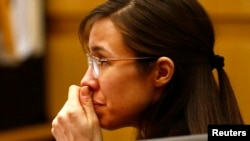 Defendant Jodi Arias listens to defense attorney Kirk Nurmi make his closing arguments during her trial at Maricopa County Superior Court in Phoenix, Arizona, May 3, 2013. Defense counsel for Jodi Arias denied in closing arguments on Friday in her high-pr