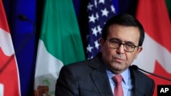 FILE - Mexico's Economy Minister Ildefonso Guajardo speaks following negotiations for a new North American Free Trade Agreement (NAFTA), in Washington, Oct. 17, 2017.