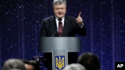 Ukrainian President Petro Poroshenko speaks at the ceremony commemorating the fallen heroes of the "Heavenly Hundred" in Kyiv, Ukraine, Feb. 16, 2017. The "Heavenly Hundred" is what Ukrainians call those who were killed during the months of anti-government protests in late 2013 and early 2014.