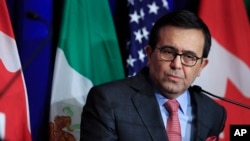 FILE - Mexico's Economy Minister Ildefonso Guajardo Villarreal speaks following negotiations for a new North American Free Trade Agreement (NAFTA), in Washington, Oct. 17, 2017.