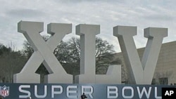 An oversized marquee for Super Bowl XLV outside of Cowboy Stadium in Arlington, Texas, February 2011