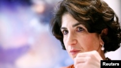 Fabiola Gianotti, scientist at the European Organization for Nuclear Research (CERN), gestures during an interview with Reuters in Meyrin near Geneva, December 15, 2014. 