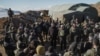 Troops gather around Prime Minister Benjamin Netanyahu as he visits a recently occupied position on the summit of Mount Hermon, inside a Syrian buffer zone of the Golan Heights, Dec. 17, 2024. (Maayan Toaf/Israeli Government Press Office)