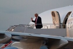 President Donald Trump waves as he steps off Air Force One upon arrival, Monday, Aug. 17, 2020, at Andrews Air Force Base, Md. Trump is returning from Minnesota and Wisconsin.