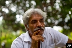 FILE - Dr. Jose Manuel Mireles, leader of his town's self-defense group, pauses during an interview with the Associated Press at his ranch in the town of Tepalcatepec, in the state of Michoacan, Mexico, Nov. 6, 2103.
