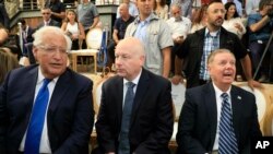 U.S. Ambassador to Israel David Friedman, from left, White House Mideast envoy Jason Greenblatt, and Sen. Lindsey Graham attend the opening of an ancient road at the City of David, in the Palestinian neighborhood of Silwan in east Jerusalem.