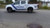 A police patrol car is seen near a bloodstain on a street in Duran, Ecuador, on October 13, 2024. Seven people were shot dead October 12 in the third massacre this week in the troubled town of Duran.