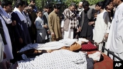 Afghan villagers with bodies of loved ones allegedly killed in Afghan-led, NATO-supported operation in Laghman province, east of Kabul, May 1, 2012.