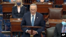 In this image from video, Senate Minority Leader Chuck Schumer of N.Y., speaks as the Senate reconvenes after protesters stormed into the U.S. Capitol on Jan. 6, 2021.