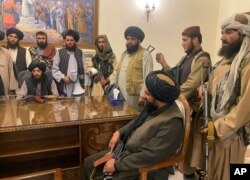 Taliban fighters are seen in Afghanistan's presidential palace after Afghan President Ashraf Ghani fled the country, in Kabul, Afghanistan, Aug. 15, 2021.