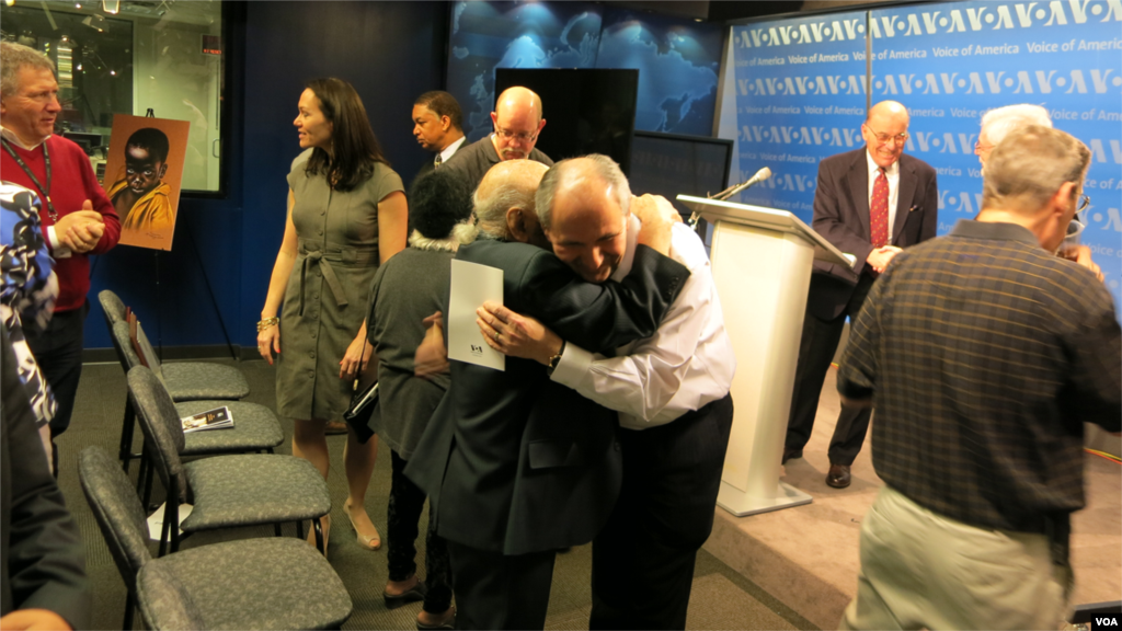 VOA Eurasia Division Director Elez Biberaj embraces Leo Sarkisian.