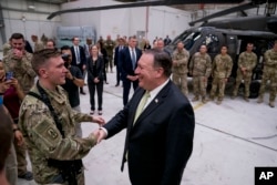 Secretary of State Mike Pompeo meets with coalition forces at Bagram Air Base, Afghanistan, July 9, 2018.