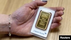 A 100g gold bar from the Credit Suisse is seen in a shop in Zurich