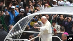 In this July 27, 2013 file photo, Pope Francis waves to people from his popemobile in Rio de Janeiro, Brazil. Latin Americans who were born into Roman Catholic families have increasingly left the faith for Protestant churches, while many others have dropped organized religion altogether in a major shift in the region’s religious identity, according to a survey released Thursday Nov. 13, 2014. (AP Photo/Andre Penner, File)