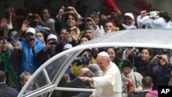 Latin is not just for the religious ceremonies. Latin is used in many movies and popular songs. In this July 2013 file photo, Pope Francis waves to people from his popemobile in Rio de Janeiro, Brazil. (AP PHOTO)