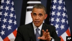 U.S. President Barack Obama answers a reporter's question during a joint news conference with South Korean President Park Geun-hye at the Blue House in Seoul, South Korea, April 25, 2014. 