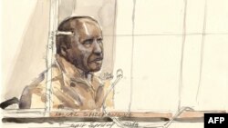 This court sketch in Paris shows Pascal Simbikangwa, a former Rwandan army captain charged with complicity in the genocide that left 800,000 dead, on the first day of his trial, the first of its kind, in France, Feb. 4, 2014.