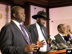 South Sudan leaders Riek Machar, left, Salva Kiir and James Wani Igga speak at a press conference a day after fighting erupts, in Juba, South Sudan, July 8, 2016.