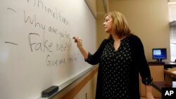 A journalism professor leads a class discussion talking about fake news at Kean University in Union, N.J., Jan. 20, 2017. A study released Monday shows many U.S. adults could not consistently differentiate between factual information and opinion statements.