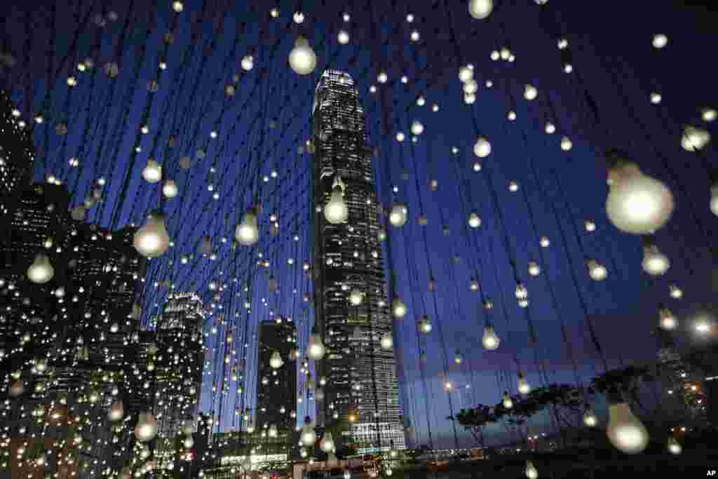 An artwork titled &ldquo;Scattered Light,&rdquo; created by American artist Jim Campbell, is lit at an exhibition in Hong Kong&#39;s Central district.