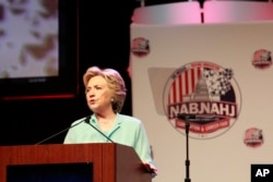 Democratic presidential nominee Hillary Clinton addresses the 2016 National Association of Black Journalists (NABJ) and National Association of Hispanic Journalists (NAHJ) joint convention, Aug. 5, 2016, in Washington.