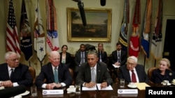 FILE - Former U.S. secretaries of state meet with President Barack Obama to discuss the Trans-Pacific Partnership at the White House in Washington, Nov. 13, 2015.