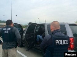 Officers from U.S. Immigration and Customs Enforcement's (ICE) are shown during an operation targeting criminal aliens and other immigration violators in Philadelphia, May 11, 2016.
