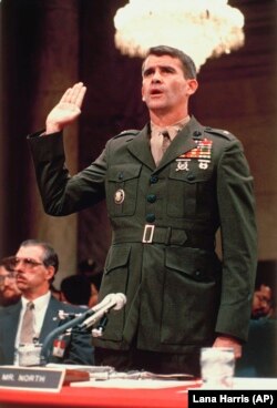 Oliver North is sworn in before the Iran Contra Committee prior to his testimony in Washington, D.C., July 7, 1987.