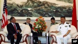 U.S. Defense Secretary Leon Panetta (L) meets with the Commander of the North Sea Fleet Vice Adm. Tian Zhong (R) in Qingdao, China before touring Chinese naval vessels, September 20, 2012.