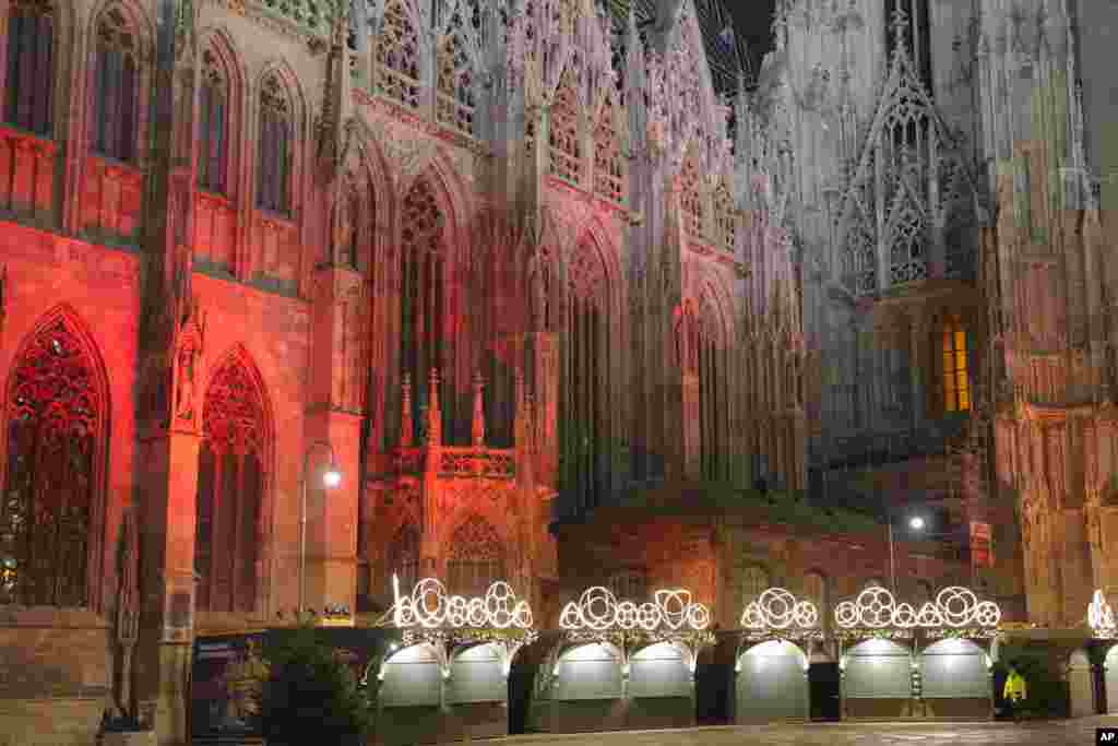 A man walks by a closed Christmas market, next to the St. Stephen&#39;s Cathedral in Vienna, Austria, Nov. 22, 2021.&nbsp;Austria went into a nationwide lockdown to combat soaring coronavirus infections.