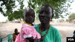 Members say the bank has made it possible to pay for their children's education and medical fees, Rumbek, Lakes State, South Sudan, Jan. 30, 2013. (H. McNeish/VOA)