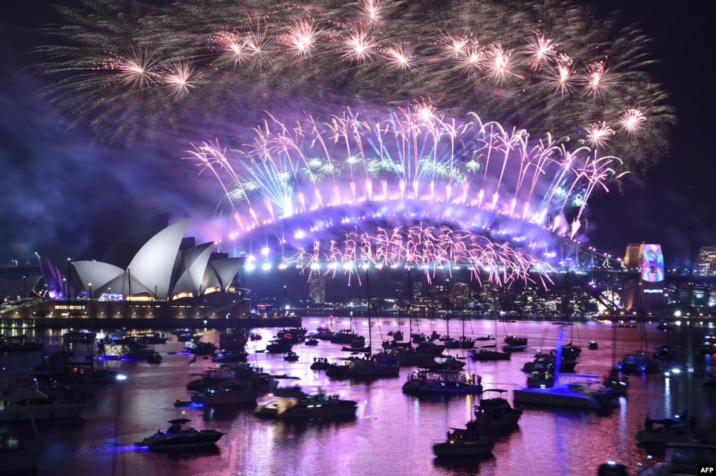 New Year&#39;s Eve fireworks erupt over Sydney&#39;s iconic Harbour Bridge and Opera House in Australia, during the fireworks show, Jan. 1, 2019.