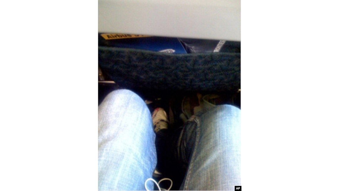 My, but this row offers a lot of legroom. Plenty of room next to you if you get the middle seat, too, no doubt.
