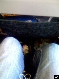 My, but this row offers a lot of legroom. Plenty of room next to you if you get the middle seat, too, no doubt.