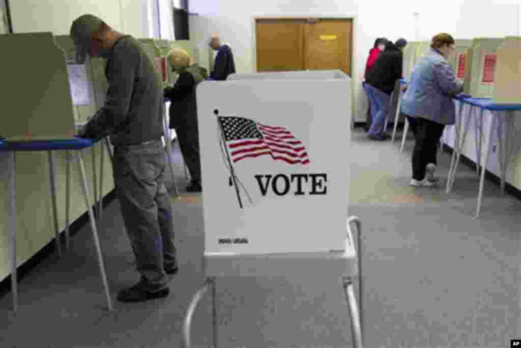 Early voters fill their ballots at the Douglas County Election Commision office, in Omaha, Neb., Friday, Oct. 29, 2010. Douglas County Election Commissioner Dave Phipps predicts a low voter turnout of 39 percent for the upcoming midterm elections. (AP Pho