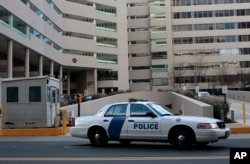 FILE - A federal law enforcement vehicle sits in front of the United State Courthouse in Baltimore.