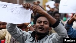 A protester chants slogans during a demonstration over what they say is unfair distribution of wealth in the country at Meskel Square in Ethiopia's capital, Addis Ababa, Aug. 6, 2016. 