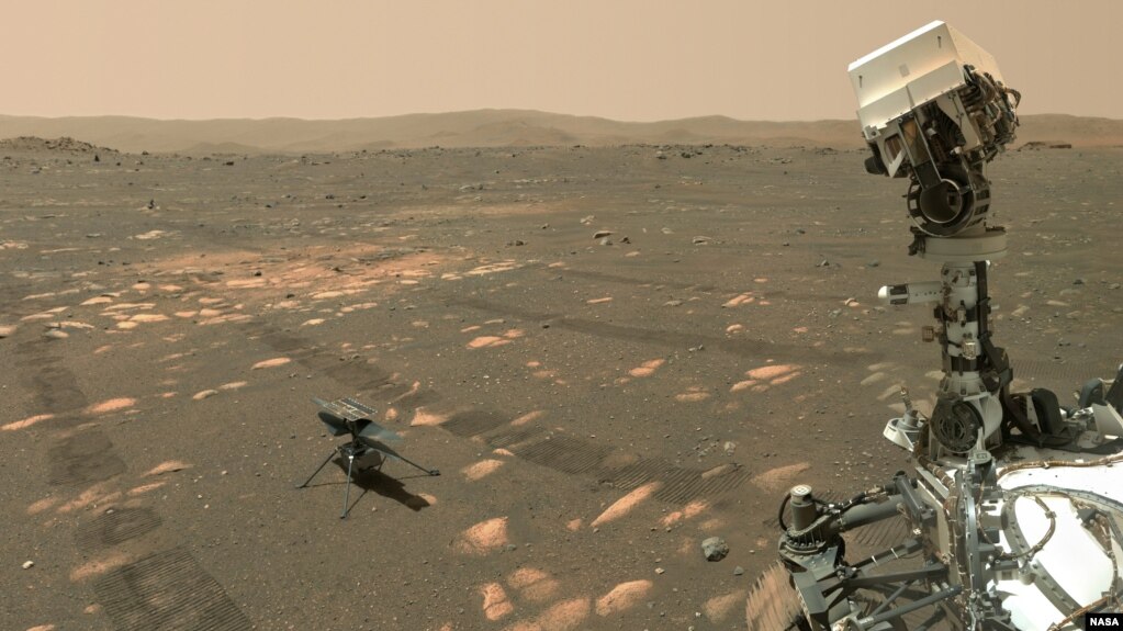 NASA’s Perseverance Mars rover took a 'selfie' with the Ingenuity helicopter, seen here about 13 feet (3.9 meters) from the rover. This image was taken by the WASTON camera on the rover’s robotic arm on April 6, 2021.