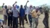 FILE - Participants of an execution by stoning are seen in Afgoye district, Somalia, Dec. 13, 2009. The al-Shabab militant group allegedly stoned to death a 44-year-old man in Rama Addey town in southern Somalia's Bay region, having found him guilty of adulter