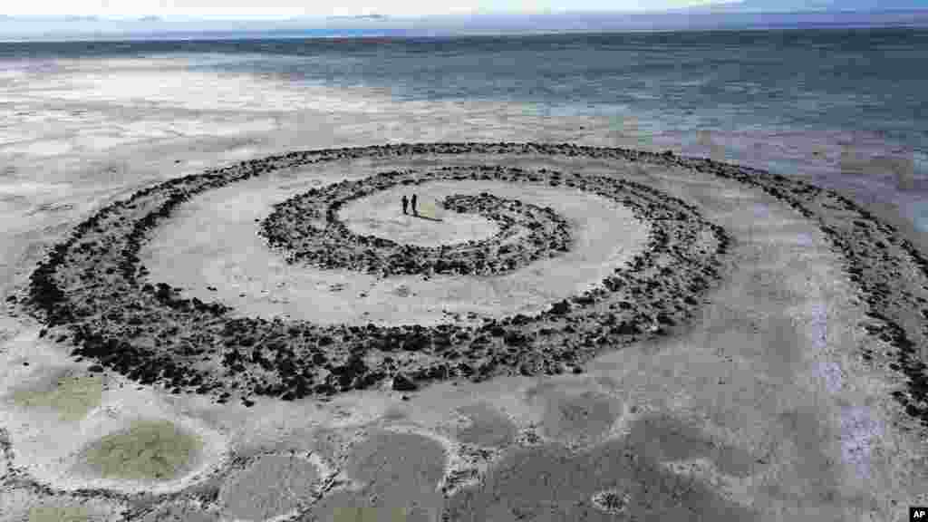 The Great Salt Lake is shown in the background of the earthwork Spiral Jetty by Robert Smithson on northeastern shore of the Great Salt Lake near Rozel Point in Utah.