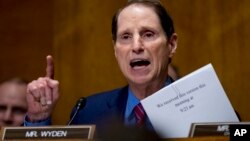 FILE - Sen. Ron Wyden, D-Oregon, speaks on Capitol Hill in Washington, Sept. 25, 2017. Wyden wants to know how well prepared the country’s top voting machine manufacturers are against hackers. 