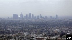 Los Angeles is often covered in thick haze. Scientists are studying this and other cities to understand the effects of climate change policies. File photo from 2009.