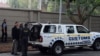 Members of the South African Asset Forfeiture Unit and other law enforcement agencies arrive to search the Gupta family compound on April 16, 2018 in Johannesburg. 