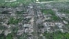 Residential buildings razed to the ground and shell craters are seen in an aerial view of Maryinka, an eastern city where the heaviest battles with the Russian troops have been taking place in the Donetsk region, Ukraine, May 11, 2023.