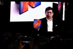 Richard Yu, CEO of Huawei Technologies Consumer Business Group, holds a Huawei Mate Xs foldable smartphone, as he talks to the audience during Huawei stream product launch event in Barcelona, Spain, Feb. 24, 2020.