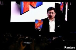 Richard Yu, CEO of Huawei Technologies Consumer Business Group, holds a Huawei Mate Xs foldable smartphone, as he talks to the audience during Huawei stream product launch event in Barcelona, Spain, Feb. 24, 2020.