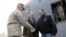 U.S. Defense Secretary Leon Panetta (R) shakes hands with Marine General John R. Allen (L), commander of International Security Assistance Force, upon Panetta's arrival at International Airport, December 12, 2012. 
