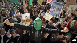 Pro-Gadhafi soldiers and supporters gather to celebrate in Green Square, Tripoli, Libya.