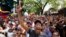 Anti-government protesters shout during a protest against Nicolas Maduro's government in Caracas, March 3, 2014.
