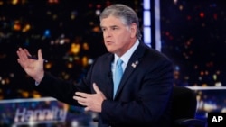 FILE - Fox News host Sean Hannity speaks during a taping of his show, "Hannity," in New York, Aug. 7, 2019. 